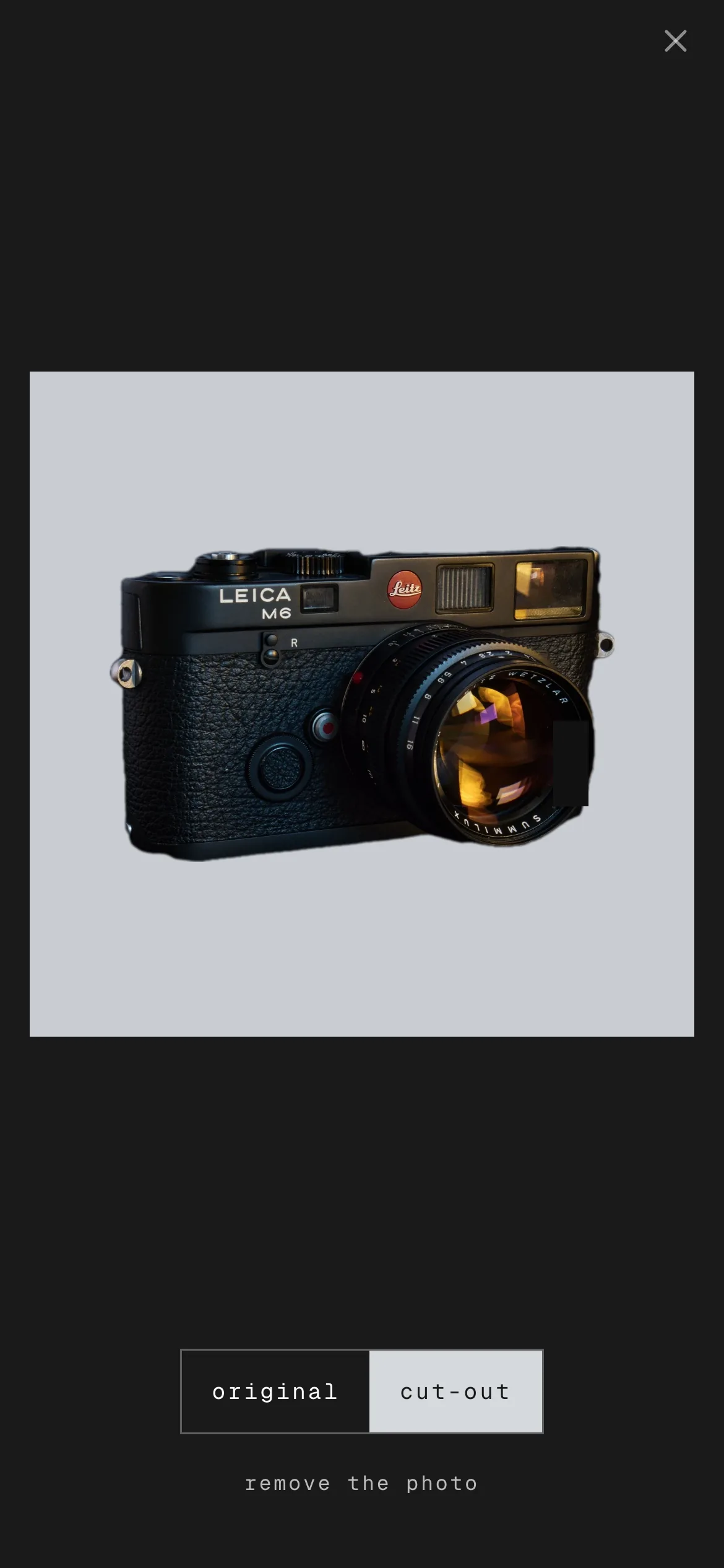 an example from a fictional practice. a photo of a leica m6 in the photo viewer after remove background, with the switch between the original and the cut-out.